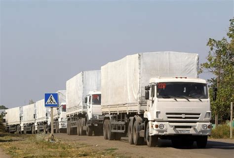 Germany Pledges Aid For Ukraine As Russia Hails A Returning Convoy