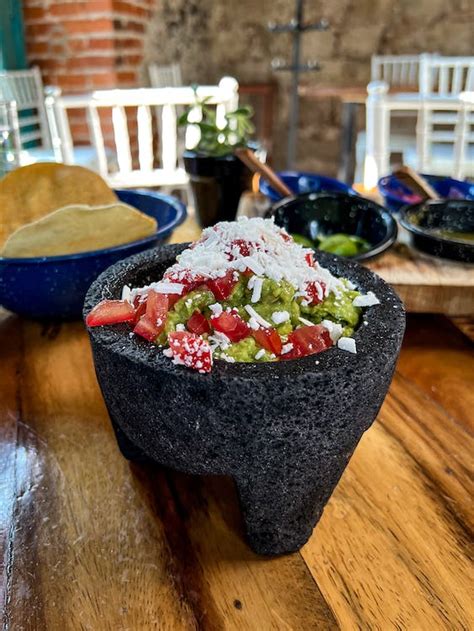 A Delicious Guacamole on Black Bowl · Free Stock Photo