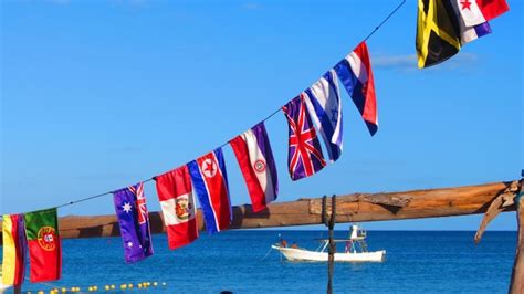 Premium Photo Multi Colored Flags Hanging Against Clear Blue Sky