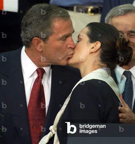 Image Of U S President George W Bush Delivers A Kiss To A