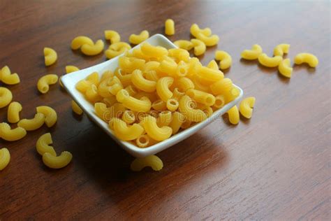 White Bowl With Dried Pasta On Wooden Table Macaroni Accidentally