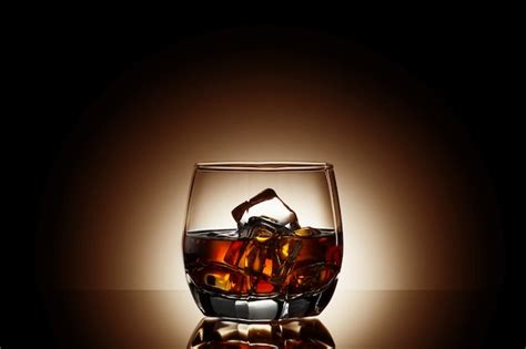 Premium Photo Whiskey On Black Background