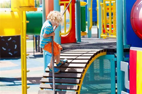 Kids on Playground. Children Play in Summer Park. Stock Image - Image ...