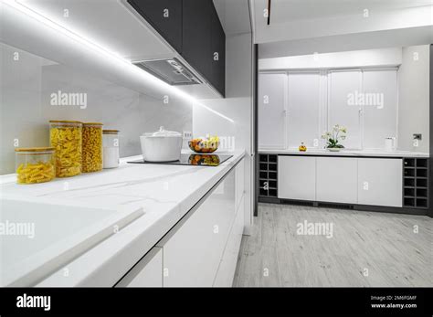 Luxury white and black modern marble kitchen Stock Photo - Alamy