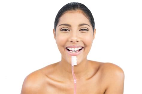 Premium Photo Cheerful Nude Brunette Holding Toothbrush