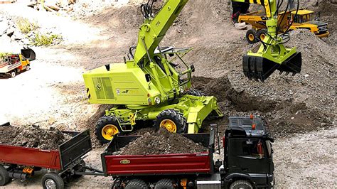 RC Construction Site With XXL Wheel Excavator And RC Trucks In Action