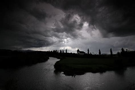 Black Storm Clouds Over a River Stock Photo - Image of dark, landscape ...