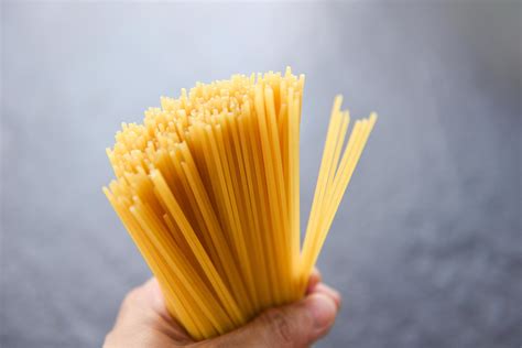 Man Holding Raw Spaghetti Italian Pasta Uncooked Spaghetti Yellow Long