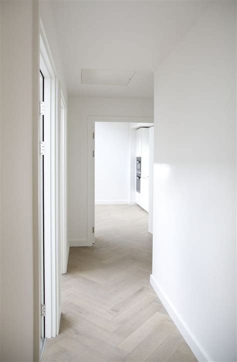 White Walls And Wood Floors In Empty Hallway