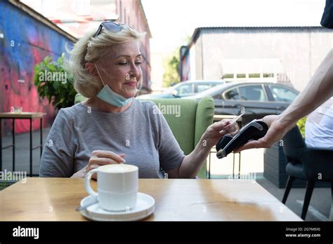 Elderly Woman Pay With Credit Card Contactless Payment Terminal Cashier