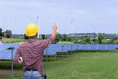Photovoltaic technology, service engineers inspecting solar cell