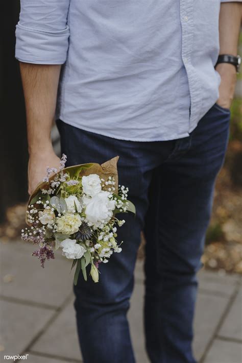 Man Holding A Bouquet Of Flowers Premium Image By