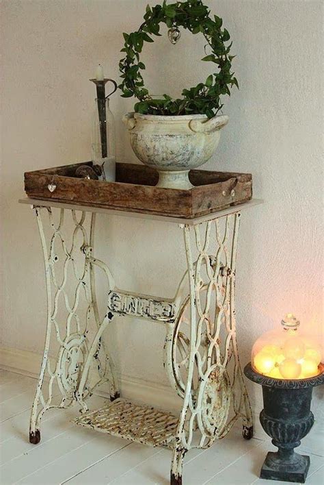 Table Made Out Of An Old Cast Iron Sewing Machine Base And A Work Bench