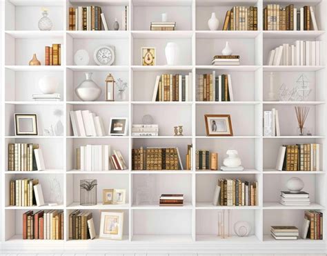 A white book shelf with many books and pictures on it | Premium AI ...