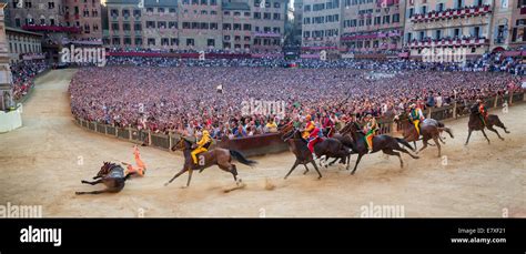 The Palio di Siena horse race on Piazza del Campo, Siena, Tuscany ...