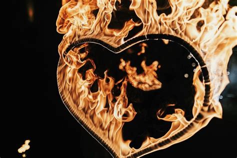 Premium Photo Heart Shaped Firework On Black Background Fire Show In