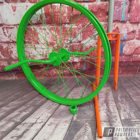 Unicycle Bike Parts finished in Kiwi Green and RAL 2009 | Prismatic Powders