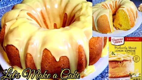 a bundt cake with icing and lemon on the top is ready to be eaten