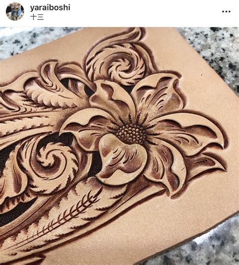 An Intricately Carved Piece Of Wood With Flowers On It