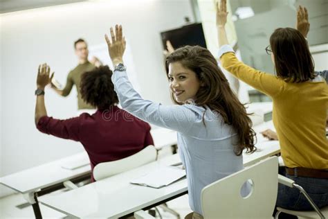 Students in a Classroom - Rising Hand Stock Image - Image of smiling ...