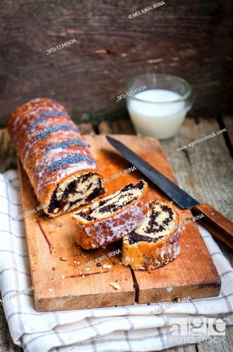 Poppy Seed Roulade Sliced On A Wooden Board Stock Photo Picture