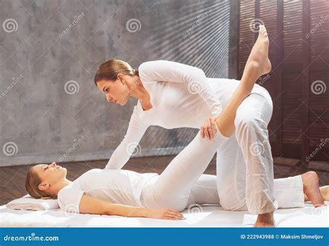 Professional Masseur Doing Thai Massage Therapist Is Making Body