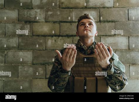 A Muslim Soldier Of The Special Forces Prays To God By Raising His