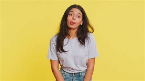 Cheerful Funny Bully Indian Woman Showing Tongue Making Silly Faces