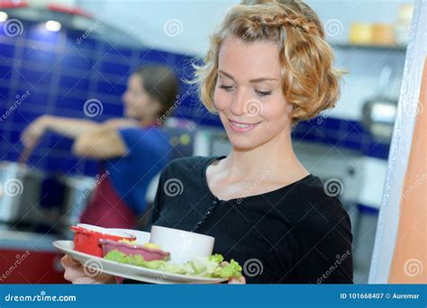 Young Blonde Waitress Holding Plate From Kitchen Stock Image Image Of