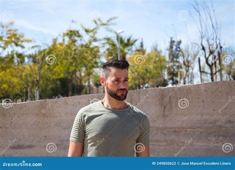 Handsome Young Man With Blue Eyes Is Standing On The Stairs Leading