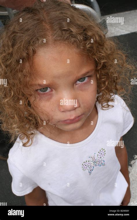 Very sad curly haired girl Stock Photo - Alamy