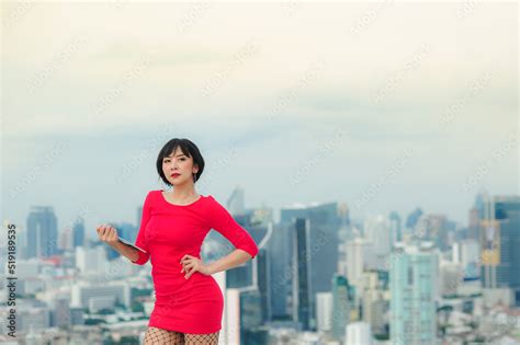 Asian Beautiful Short Haired Business Women Wearing A Red Dress And