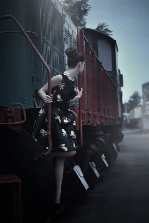 Free photo: Woman in Black Sleeveless Dress Standing Beside Train