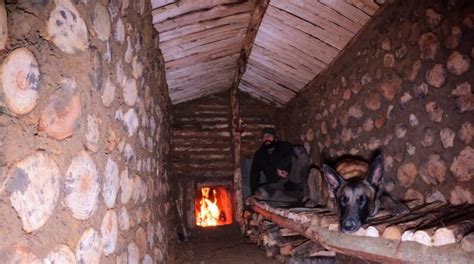 Building Warm Bushcraft Survival Shelter In Wildlife Fireplace