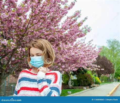 Allergy. Woman Wearing Protect Mask from Pollen Allergy Stock Photo ...