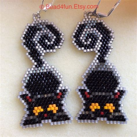 The Beaded Earrings Are Designed To Look Like Cartoon Characters