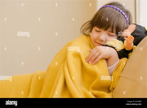 Young Girl Lying On Sofa Pretending To Sleep Stock Photo Alamy