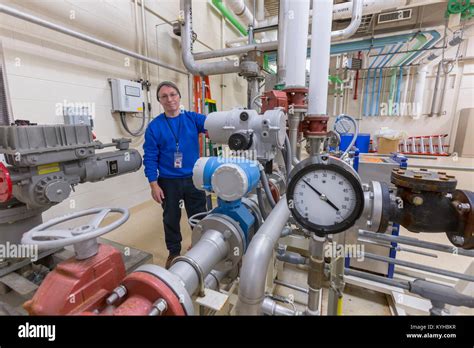 Water Treatment Plant Engineer Inspecting Chemical Treatment Equipment