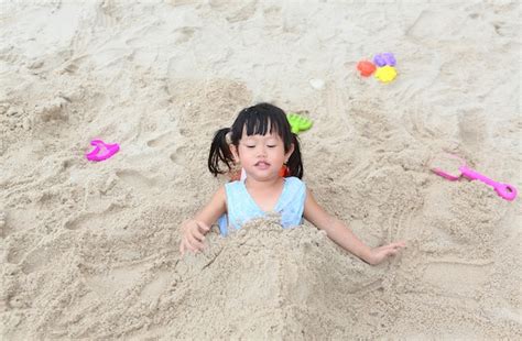 Premium Photo Cute Little Asian Child Girl Playing Sand At The Beach