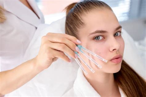 Professional Cropped Plastic Surgeon Drawing Contours On Woman S Face