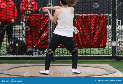 Female Throwing the Weight during an Indoor Weight Throw Competition ...