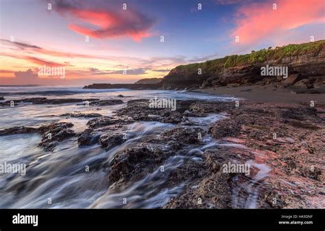 Melasti beach at sunset, Bali, indonesia Stock Photo - Alamy