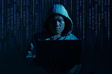 Premium Photo Hacker Try To Hack Information By Laptop And Computer