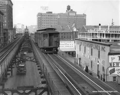 A Boston Elevated Railway train of 0300-class cars , near Rowes Wharf ...