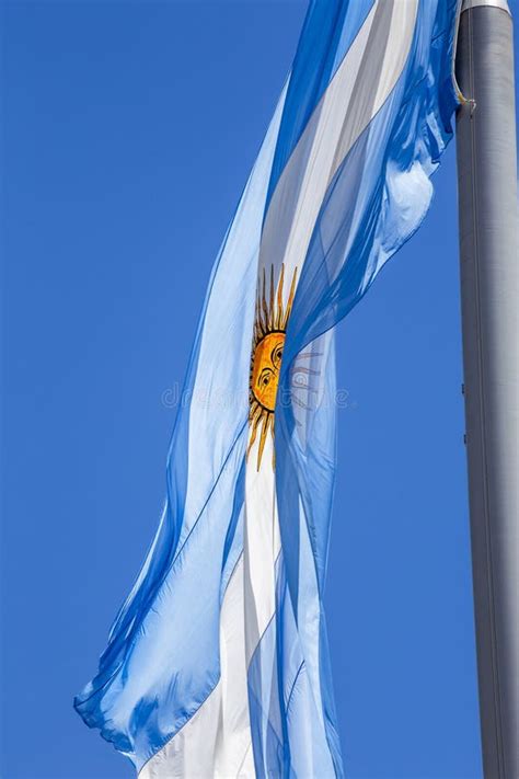 Argentine Flag Flying on a Flagpole Against a Blue Sky on a Sunny Day ...