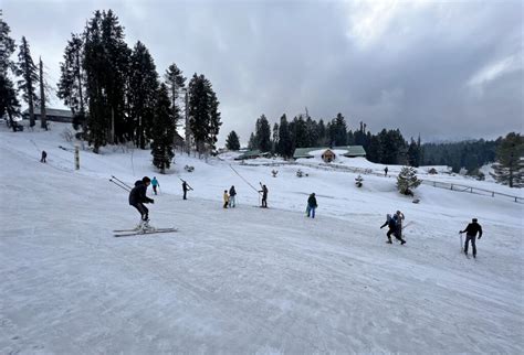 Tourists enjoy skiing on the snow-covered area of the Gulmarg Ski resort - The Daily Guardian