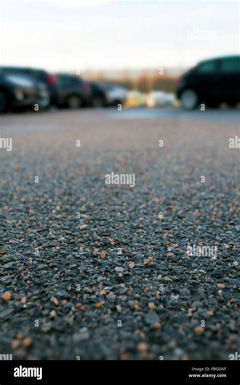 Close up of rock salt or gritting salt on a car park in cheshire to prevent and overnight frost ...