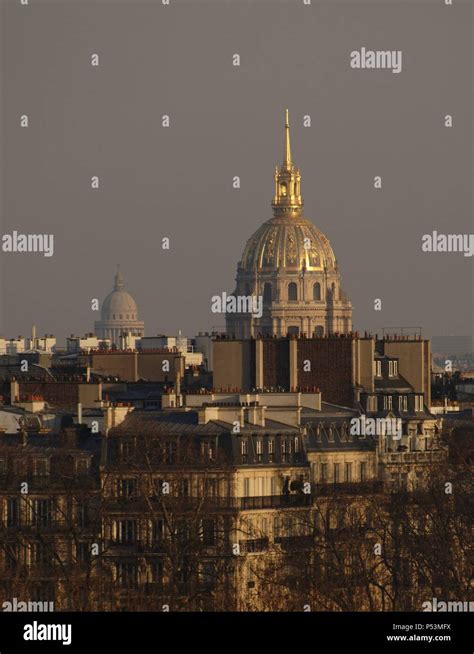 France Paris Cityscape In The Background Stands The Golden Dome Of