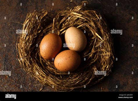 Big Red Eggs In A Golden Nest Photo In Rustic Style Stock Photo Alamy