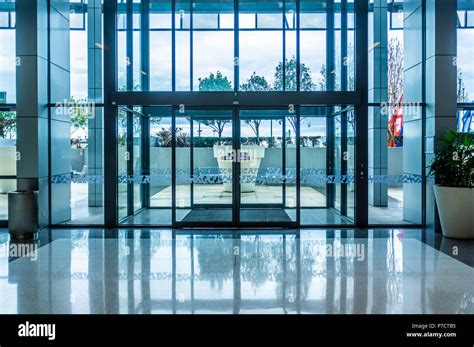 Glass automatic sliding doors entrance into shopping mall Stock Photo ...